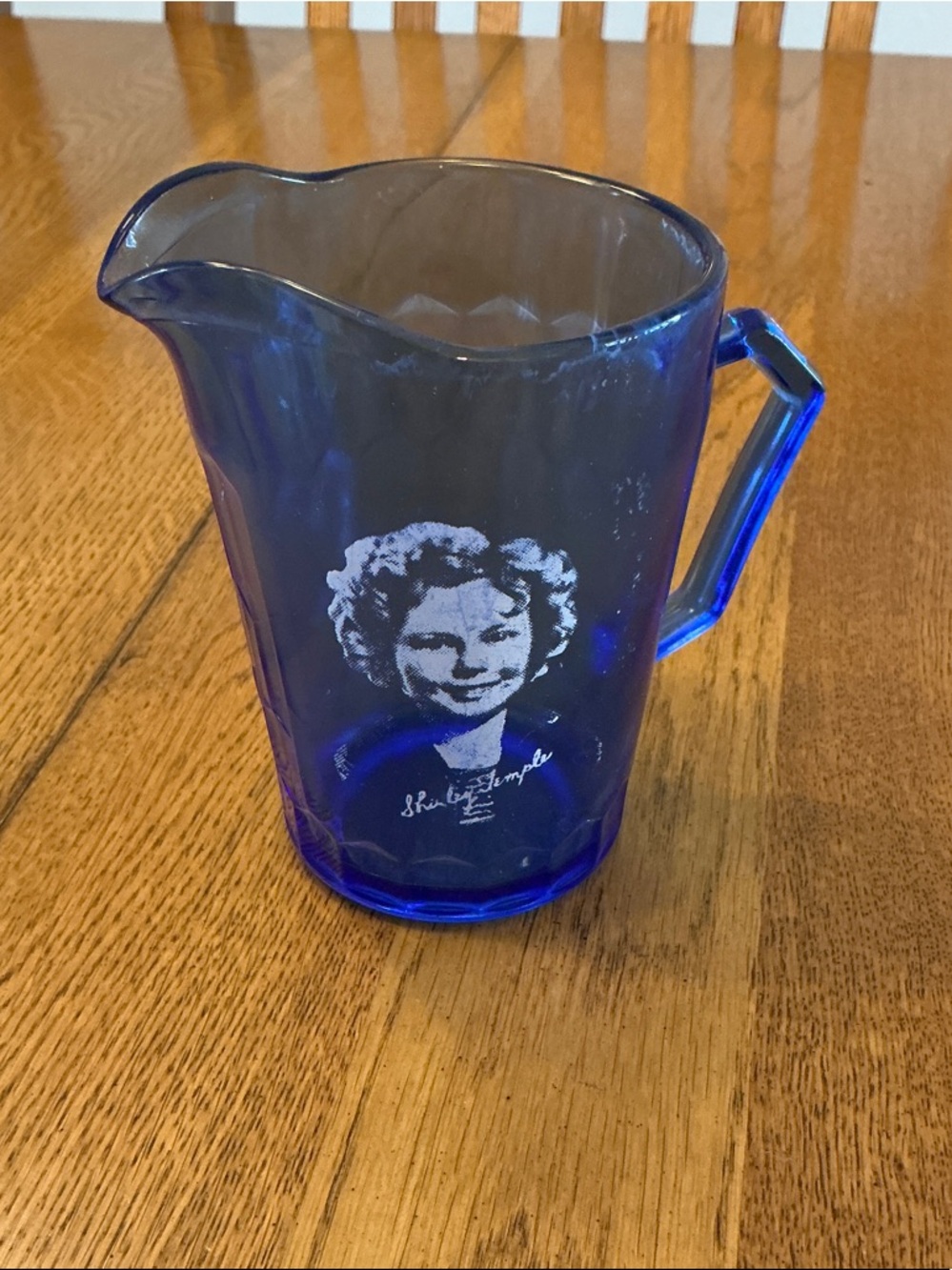 Home Shirley Temple blue pitcher. 4.25’ Hx 9” circumference .